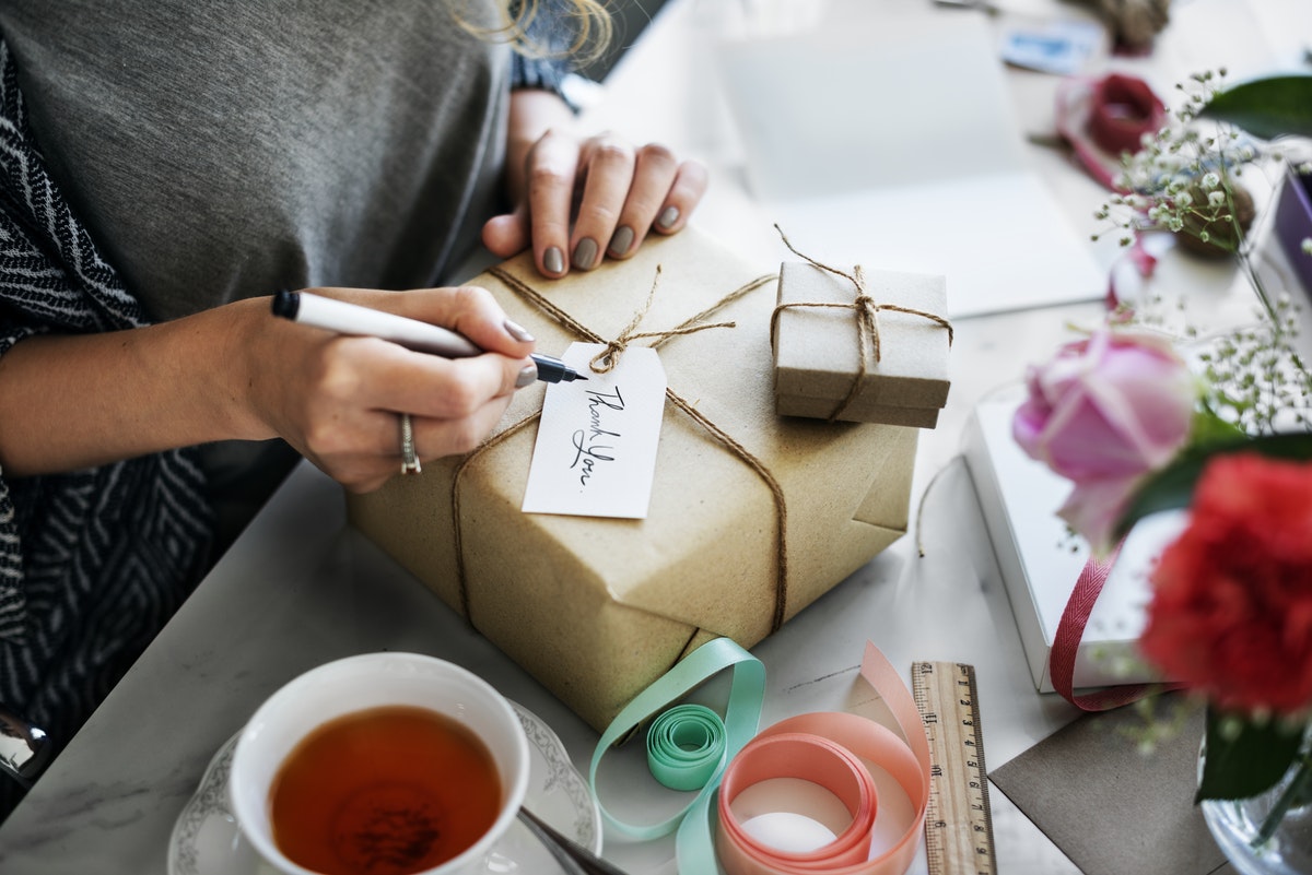 Woman wrapping gifts for the holidays